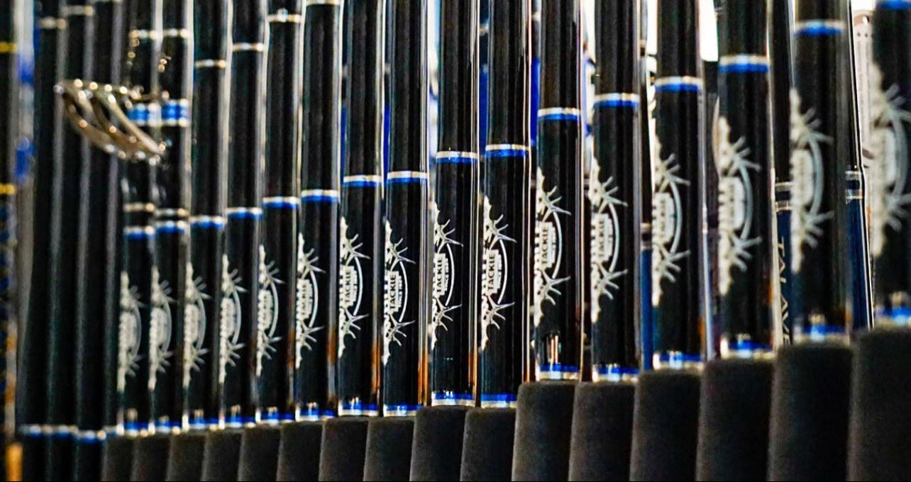 Row of fishing rods with branding on a blurred background