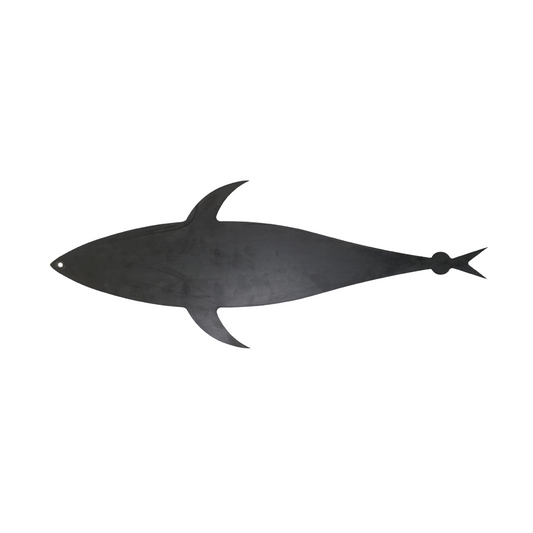 Black shark-shaped cutting board on a white background